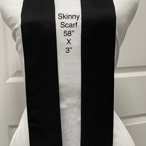 May include: Black skinny scarf, 58 inches long and 3 inches wide.  NeckWearthyByLois.