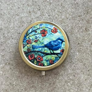 Estuche para pastillas o joyero con forma de pájaro azul