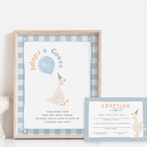 May include: A framed print and adoption certificate featuring a cartoon goose holding a blue balloon. The print has a light blue gingham border and text that reads "Adopt a Goose." The certificate has space for the adopter's name and goose's name.
