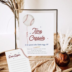May include: A baseball-themed time capsule sign with a baseball balloon and stars. The sign says "Time Capsule" and "to be opened when Dylan turns 18!" There is a blank card with the text "Dear Dylan" and a line for writing a message.