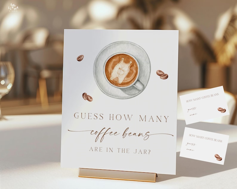 May include: A white sign with the text "GUESS HOW MANY coffee beans ARE IN THE JAR?" features a watercolor illustration of a coffee cup and scattered coffee beans. Two smaller cards are also visible.