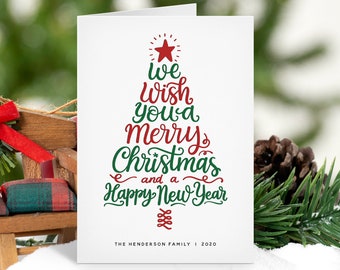May include: A white Christmas card with a red star and green text that reads "We wish you a Merry Christmas and a Happy New Year". The card also includes the text "THE HENDERSON FAMILY I 2020" and "EDENWOODPAPERIE.COM".