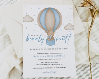 May include: A baby shower invitation with a blue and brown hot air balloon with a teddy bear inside. The text reads "We can barely wait! Baby Boy Campbell is on the way! Join us for a baby shower honoring Natasha & Mark Campbell Saturday, October 7th at 12:00pm The Campbell Residence 1500 Seneca Avenue Sacramento, CA RSVP to Julie at 000.000.0000 by September 28th registered at Target"