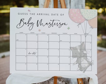 Op de afbeelding: Een witte kalender met een zwarte lijst en zwarte tekst. De kalender heeft de titel "Raad de aankomstdatum van Baby Masterson". De kalender heeft een schattige cartoonkat met ballonnen in de hoek. De kalender is ingesteld voor juni en juli.