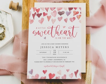 May include: A pink and white baby shower invitation with watercolor hearts and the text "A little sweetheart is on the way!"  Join us for a baby shower honoring Jessica Meyers, Saturday, February 19, 20XX, 11:00 AM, The Thompson Residence, 5661 J Street | Sacramento, CA. Please RSVP to Amanda at 000.000.0000 by February 9th. Registered at Amazon & Target.