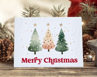 May include: A white card featuring three watercolour Christmas trees and gold stars. The text "Merry Christmas" is printed in red at the bottom of the card.
