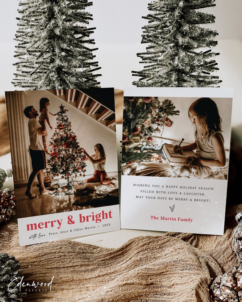 May include: A Christmas card featuring a photograph of a family decorating a Christmas tree. The card reads "merry & bright with love Peter, Alice & Chloe Martin, 20XX" and "WISHING YOU A HAPPY HOLIDAY SEASON FILLED WITH LOVE & LAUGHTER. MAY YOUR DAYS BE MERRY & BRIGHT! The Martin Family".
