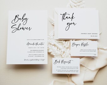 May include: A white baby shower invitation with black calligraphy text. The invitation reads "Baby Shower" and includes the name "Amanda Martin", the date "August 22, 2021", the time "1:00-4:00 PM", the location "The Henderson Residence", the address "102 Senica Lane, Sacramento, CA", the RSVP information "RSVP to Lauren by August 15th", the phone number "1612-345-4547", and the email address "hello@gmail.com". The invitation also includes the text "Amanda is registered at Target".