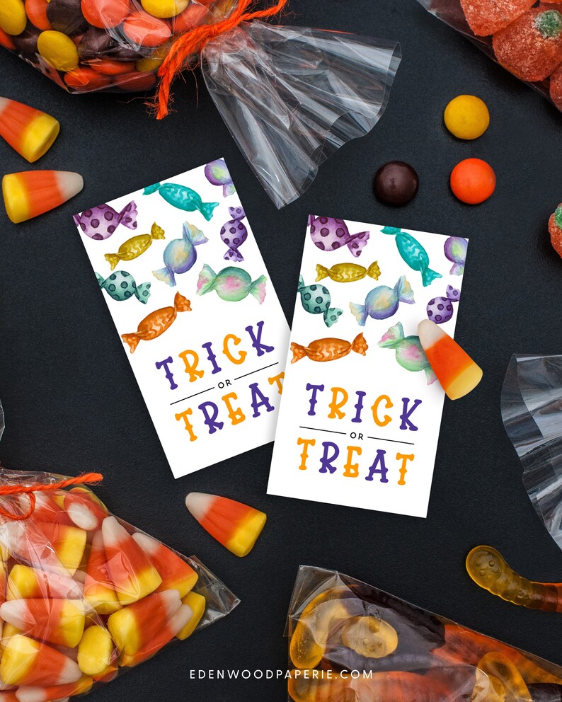 May include: Two printable Halloween trick or treat tags with a candy pattern. The tags are white with purple and yellow text. The text says "Trick or Treat".