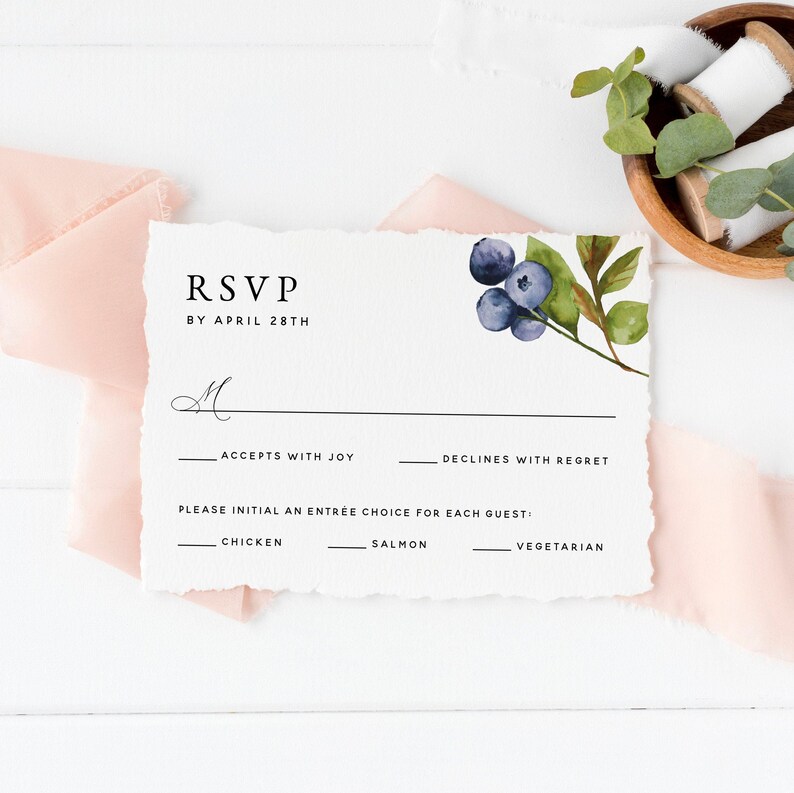 May include: RSVP card with a watercolor illustration of blueberries and leaves. The card has text that says "RSVP by April 28th" and includes options for accepting or declining the invitation, as well as a choice of chicken, salmon, or vegetarian for the meal.