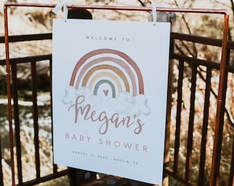 Puede incluir: Un cartel blanco con un diseño de arcoíris y el texto "Bienvenido a la Baby Shower de Megan el 12 de agosto de 20XX - Austin, TX".