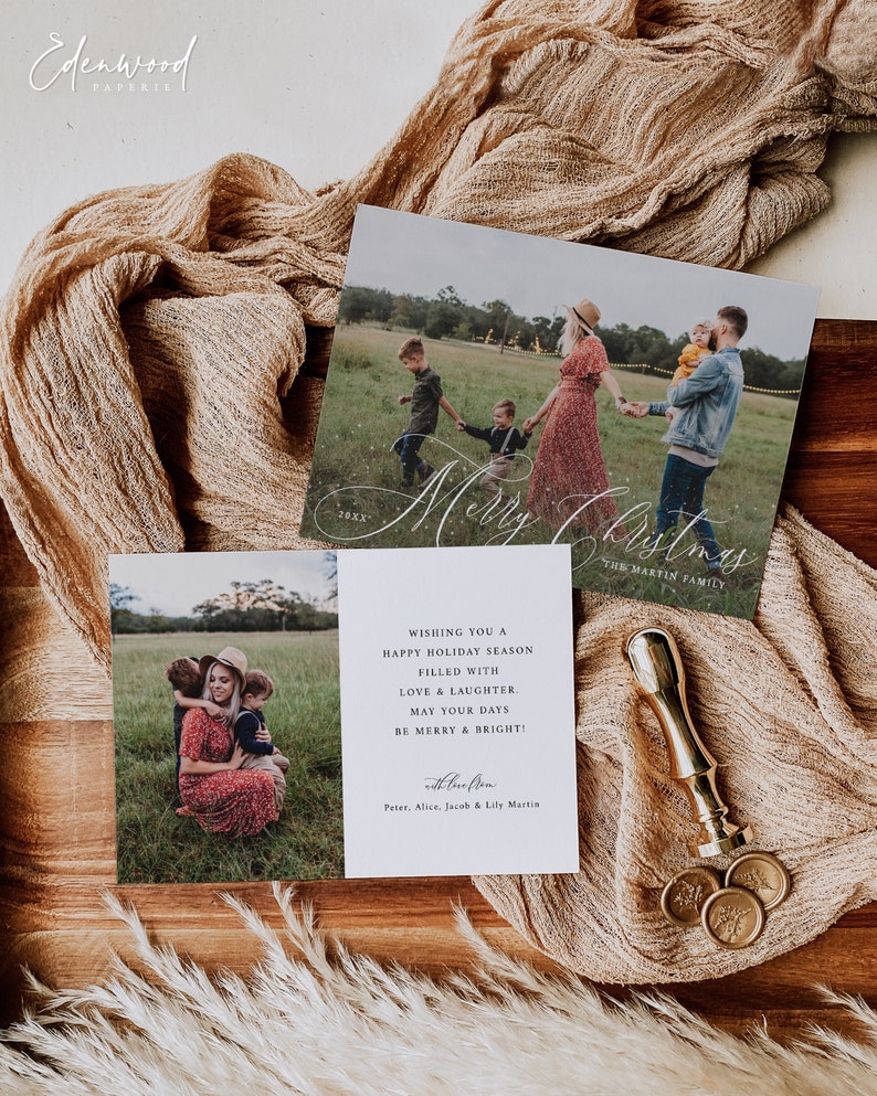 May include: A white Christmas card featuring a photograph of a family of four in a field. The card reads "Merry Christmas" in cursive script and "The Martin Family" underneath. The text "Wishing you a happy holiday season filled with love & laughter. May your days be merry & bright!" is printed below the photo. The card is signed "with love, Peter, Alice, Jacob & Lily Martin".