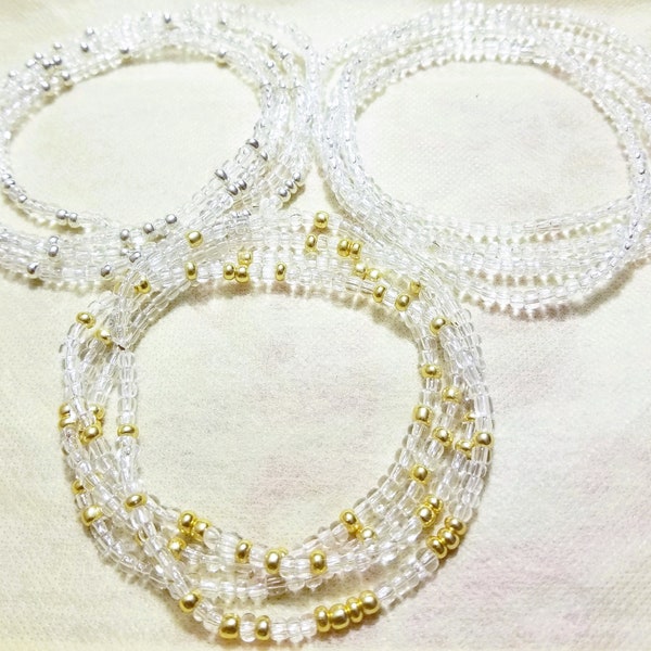 3 Pack stretch elastic handmade African waist beads set. Clear, Silver, and Gold. Plus size and extra small available.