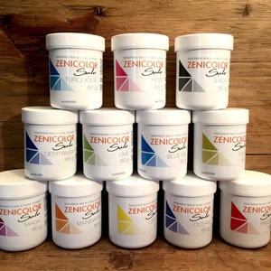 May include: Twelve small jars of paint, each labeled "Zenicolor Sole" with a different color and name. The colors include turquoise, rose, space, deep river, lime, blue sky, magic, mandarin, lemon, ocean, and passion.