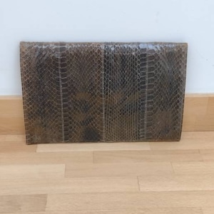 A fabulous vintage snakeskin envelope clutch bag