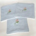Lot of reusable cotton embroidered wipes and micro-sponge in blue and beige color