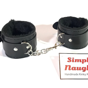 Handmade Black PU Leather bondage HandCuffs with a Comfortable Soft Fur Interior Lining.