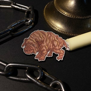 May include: A sticker of a cartoon pink and brown creature with a wrinkled texture. The creature has four legs and a long snout. The sticker is on a black background.