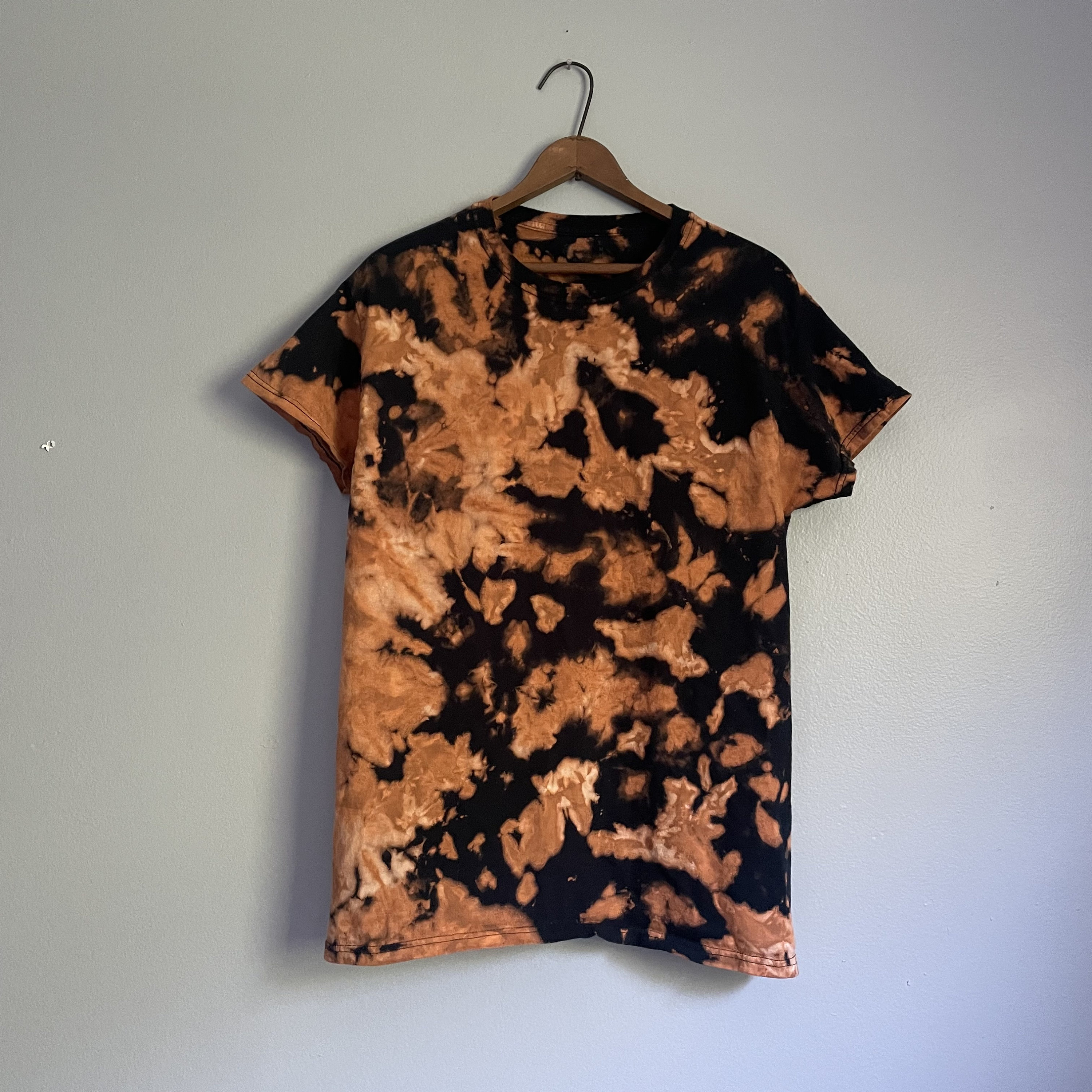 reverse tie dye orange shirt