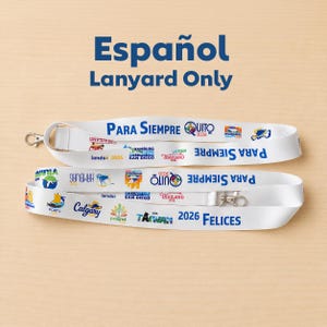 May include: A white lanyard featuring blue text that reads Para Siempre and 2026 Felices, along with various colorful graphic logos and city names including Quito, Hamburg, San Diego, Thailand, Porto, Calgary, Poland, and Taiwan printed throughout.