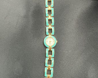 Retro 90’s Turquoise and Gold tone Avon watch.