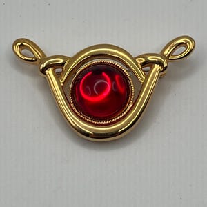 Vintage signed Park Lane pendant/pin with ruby red glass cabochon.