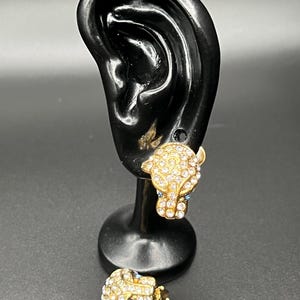 Boucles d'oreilles clip vintage Park Lane Panther dorées avec strass.