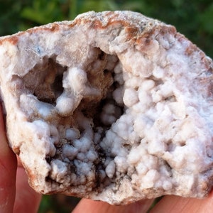Botryoidal Chalcedony Geode Half: Orange Silica, White Crystal