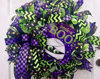 Halloween Boo Wreath to bring in the season and hang on your Front Door. Halloween Wreath will hang in many places to celebrate Halloween.