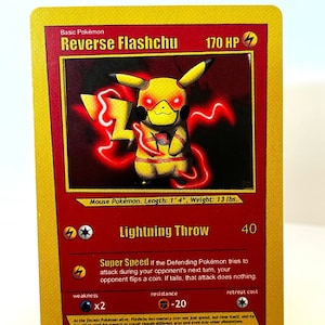 May include: A Reverse Flashchu Pokemon card with a yellow and red illustration of the Pokemon. The card has a gold background and features the text "Reverse Flashchu" and "170 HP". The card also has a lightning bolt symbol and the text "Lightning Throw" with a power of 40.