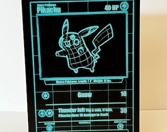 May include: A black and blue Pokemon trading card featuring Pikachu, a mouse Pokemon. The card has a black background with blue text and graphics. The card text reads "Basic Pokemon Pikachu 40 HP". The card also includes the text "Gnaw 10", "Thunder Jolt 30", "Mouse Pokemon. Length: 14". Weight: 13 lbs.", "When several of these Pokemon gather, their electricity can cause lightning storms."