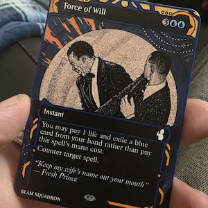 May include: A rectangular trading card titled Force of Will featuring a black and white illustration of two men in suits. The card text reads: You may pay 1 life and exile a blue card from your hand rather than pay this spell's mana cost. Counter target spell. Keep my wife's name out your mouth — Fresh Prince.