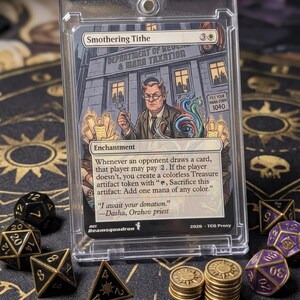 May include: A Smothering Tithe trading card in a clear plastic magnetic case. The card features an illustration of a horned figure in a suit standing before a building labelled Department of Revenue & Mana Taxation, with text detailing game rules.