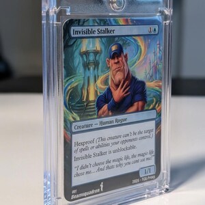 May include: A collectible trading card titled Invisible Stalker encased in a clear magnetic acrylic holder. The card features a cartoon illustration of a man in a blue shirt and cap, with text including Hexproof, Creature - Human Rogue, and 1/1.
