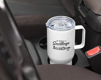 It Takes a Sevillage Travel mug with a handle