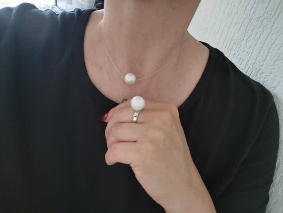 Simple pearl necklace. Large floating pearl. Pearl on invisible