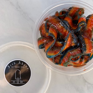 Gourmet Sour Belts coated in Homemade chamoy and spice seasoning