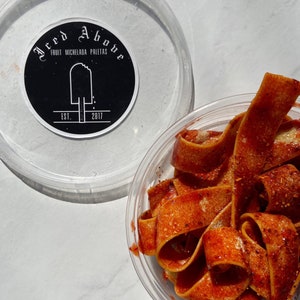 Iced Above Pineapple flavored sour belts coated in homemade chamoy and spice mixture