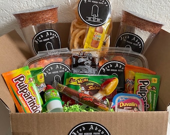 Iced Above Snack Attack Box with gourmet sweet and spicy gummy candies and other Mexican treats