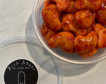Gourment Sweet and Spicy Mango Gummies coated with homemade chamoy and spice seasoning