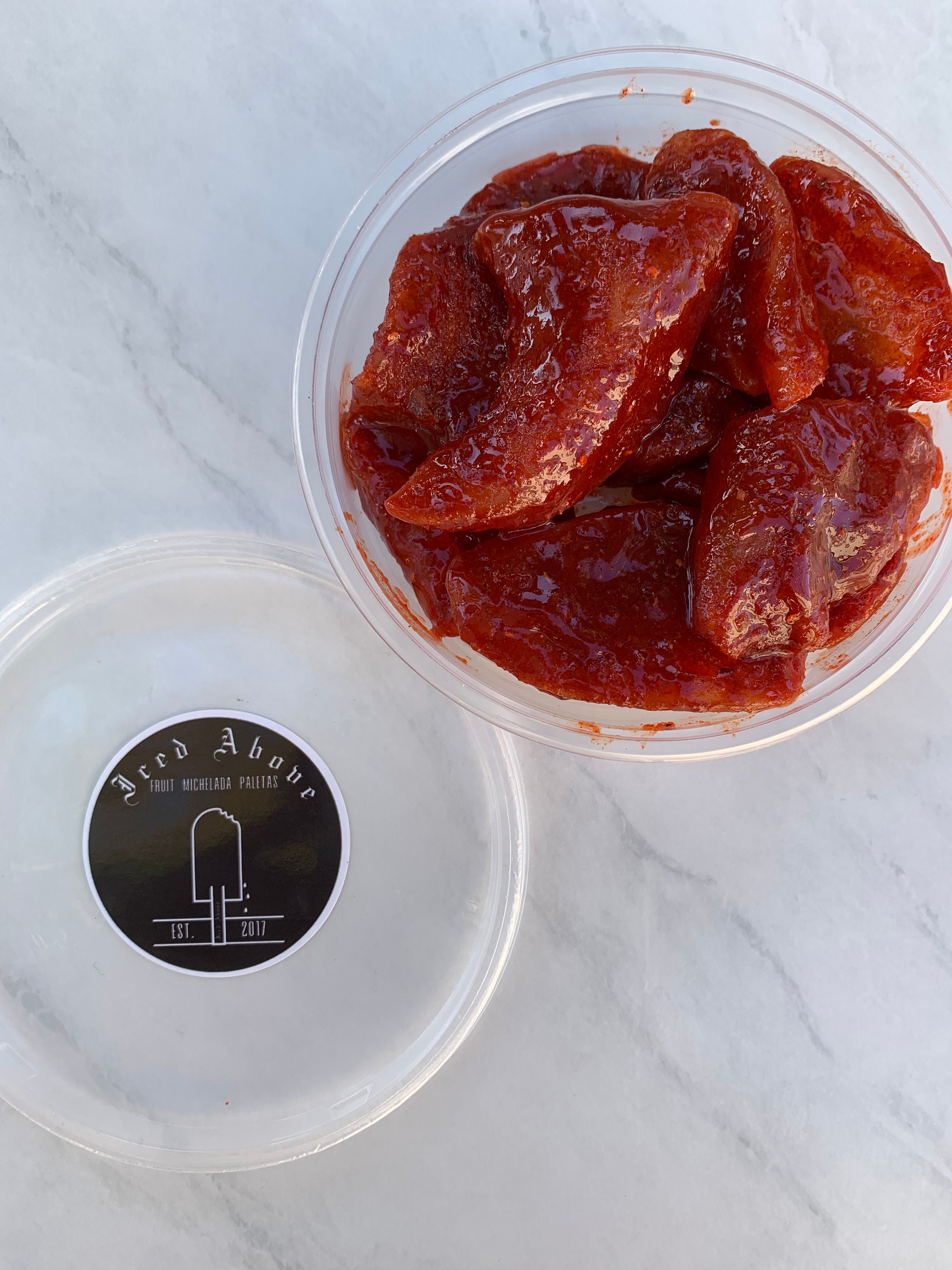Gourmet Sweet Dried Mango coated in Homemade chamoy and spice seasoning