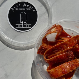 Gourmet sweet and sour pineapple belts in homemade chamoy and spice seasonings