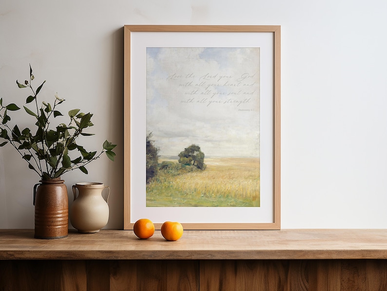 This vintage painting of a yellow and green field with a blue sky features a Bible verse from Deuteronomy 6, the Shema.