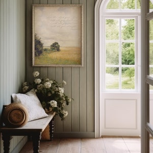 May include: A framed print with a quote about trusting God with all your heart, mind, and strength. The print features a painting of a field with trees in the background.