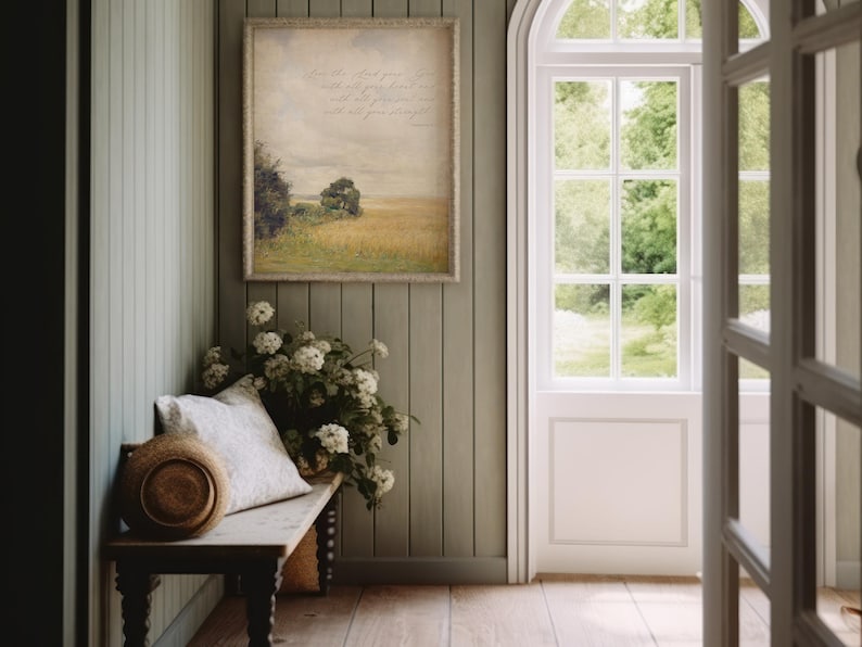 May include: A framed print with a quote about trusting God with all your heart, mind, and strength. The print features a painting of a field with trees in the background.
