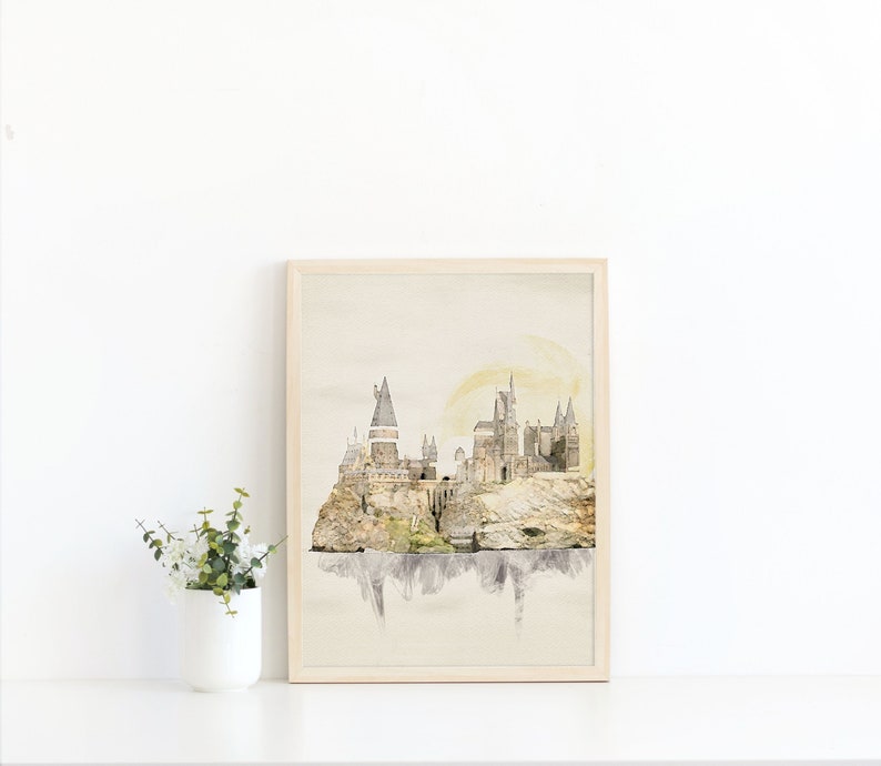 Close of up of the watercolor castle printable. It has subtle tans and grays, with a pale yellow moon rising behind it.