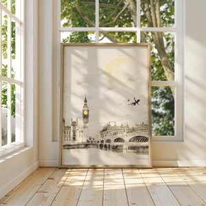 Finally there is a watercolor of London in grayscale, warm whites, and yellows. It features Big Ben glowing in the distance with the London bridge stretching over the river to the right. Peter Pan and tinker bell are flying silhouettes in the sky.