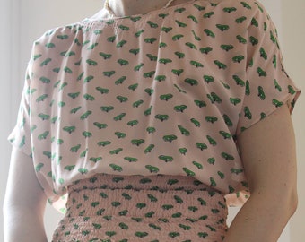 Blusa icônica Prada Pink de seda rosa carros