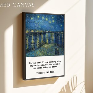 The image is a framed canvas depicting a night sky with stars, and it is hanging on a wall.