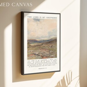 May include: Framed canvas art print featuring a pastoral landscape with sheep and the text "THE LORD IS MY SHEPHERD." The artwork includes text from Psalm 23:1-3, set in a black frame.